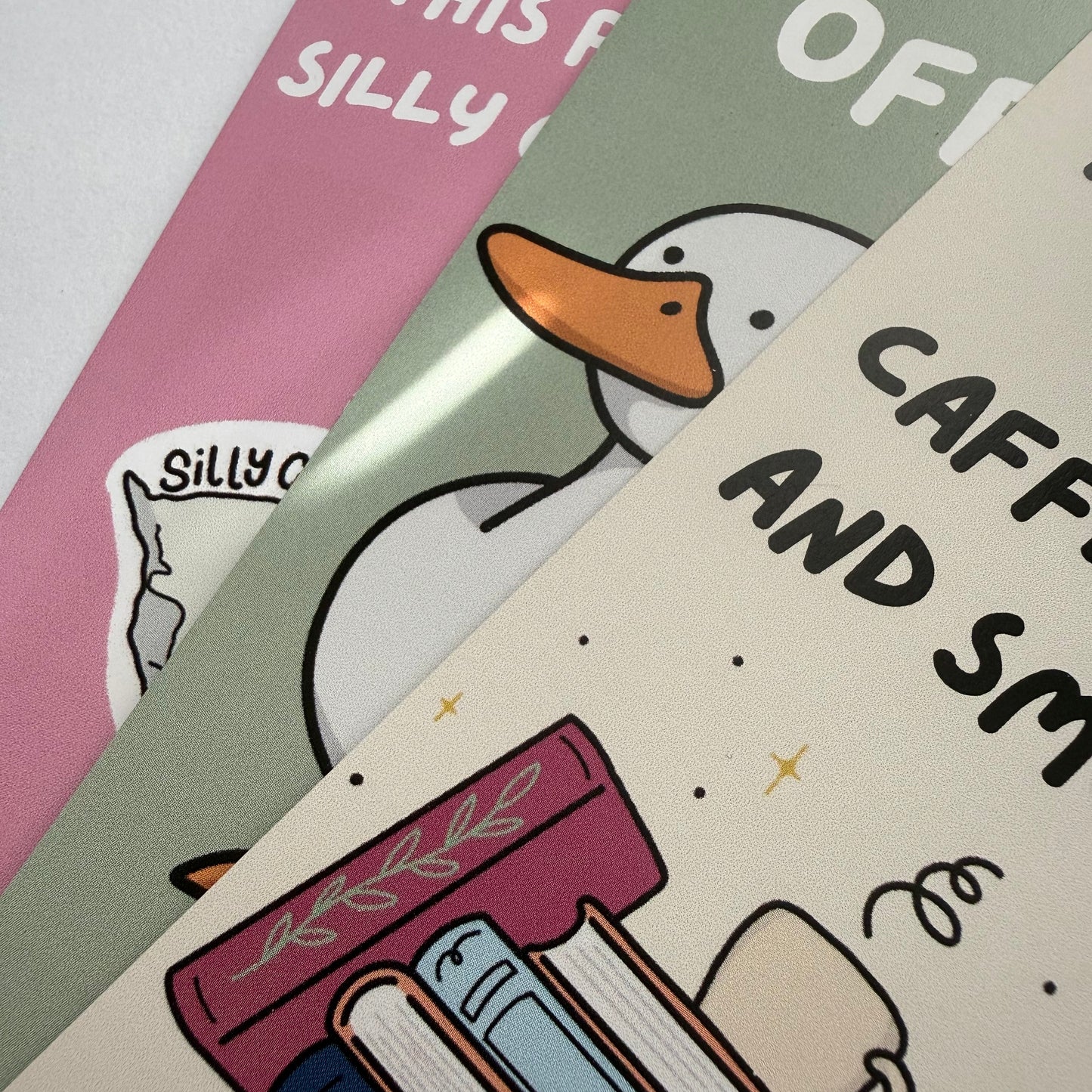 Cartoon duck with books and coffee cup on a colorful background